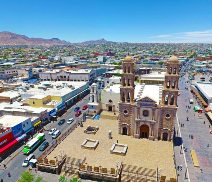 Foto aérea del Centro Histórico de Ciudad Juárez, con vista a espacios residenciales y zonas naturales.